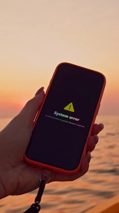 Vertical video. Hand Holding Smartphone Showing System Error Message While Sitti Stock Footage 329641198