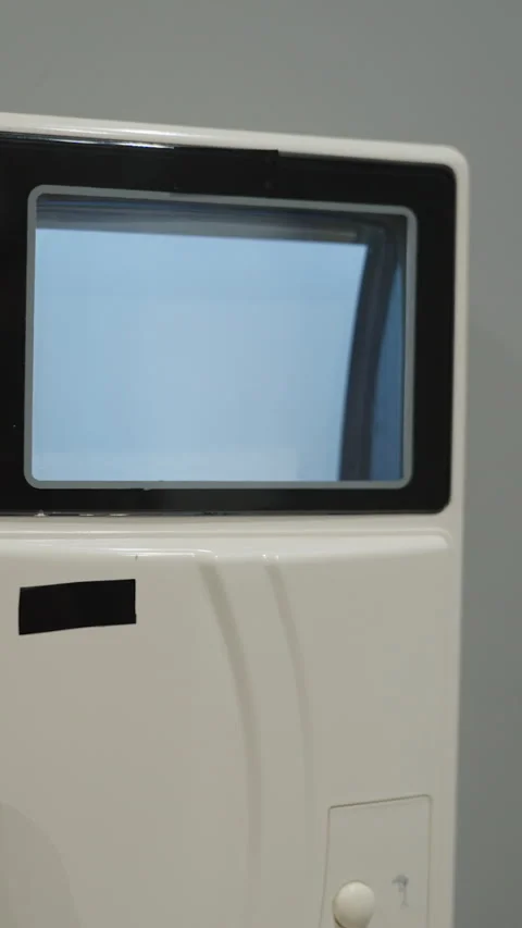 Vertical video. Hand Picking Up The Receiver Of An Old White Intercom With A Stock Footage 301352671
