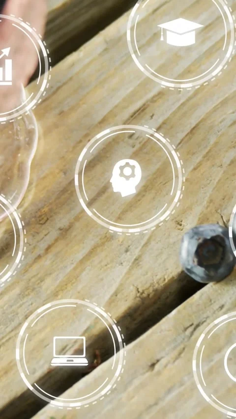 Vertical video: Hand placing blueberry bowl on wood HUD icons floating for food Stock Footage 334387045