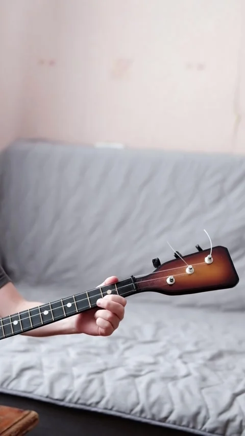 Vertical video of a hand playing the balalaika Stock Footage 299182448
