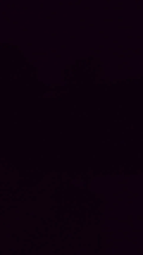 Vertical video. Hand Pulling Chain Switch To Turn On Wall Lamp In Dark Room As W Stock Footage 326966764