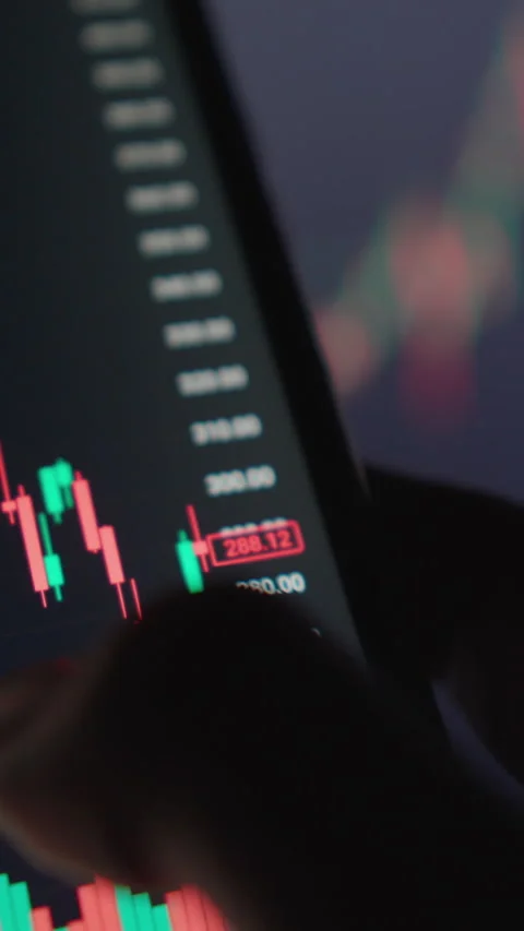 Vertical video hand is seen interacting with a mobile device, displaying Stock Footage 277908262