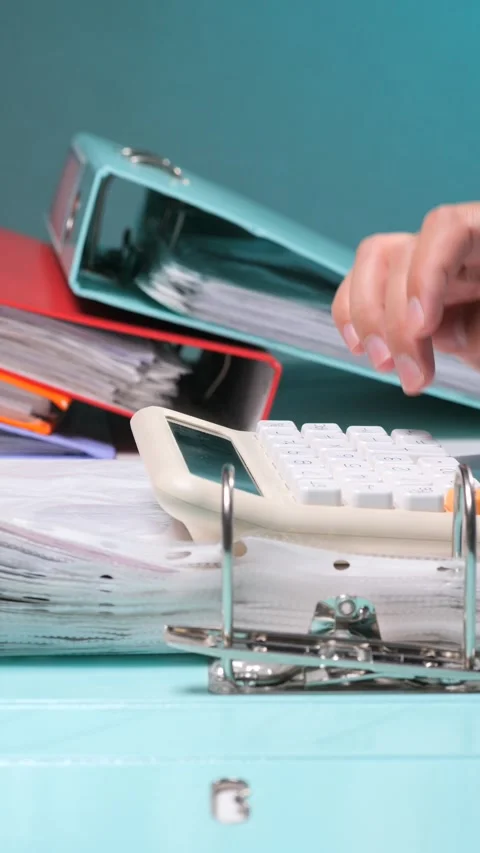 Vertical video hand using calculator for financial calculations and accounting Stock Footage 342770658