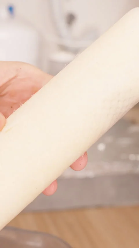 Vertical video. Hands Holding a Used Paper Filter from a Reverse Osmosis System, Stock Footage 296574346