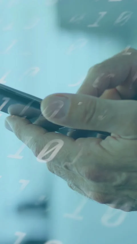 Vertical video: Hands with smartphone thumb tapping and swiping while binary Stock Footage 334046573