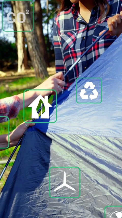 Vertical video: Hands threading pole through sleeve, campers securing tent and Stock Footage 334541420