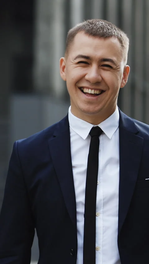 Vertical Video of handsome man in tie smiling cheerfully to camera at street Stock Footage 302804353