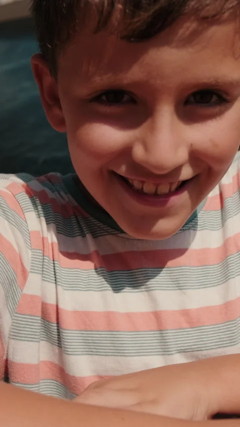 Vertical video, Happy Boy Smiles At City Playground Stock Footage 309403392