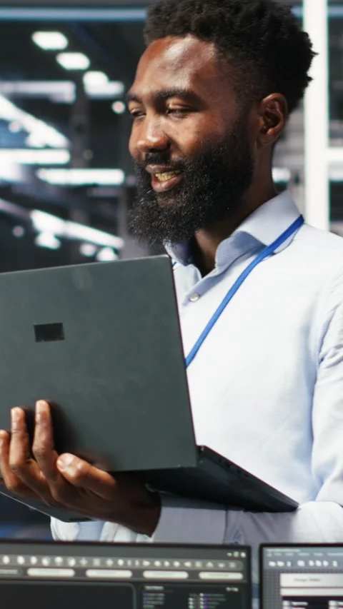 Vertical video Happy data center admin using node tree tool doing high five with Video stock 307968828