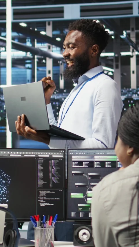 Vertical video Happy data center admin using node tree tool doing high five with Video stock 307968872