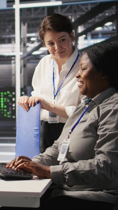 Vertical video Happy data center manager pleased by work done by team Stock Footage 309255872