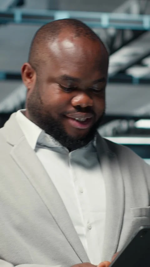 Vertical video Happy engineer walking in data center refining algorithms on Stock Footage 311417508