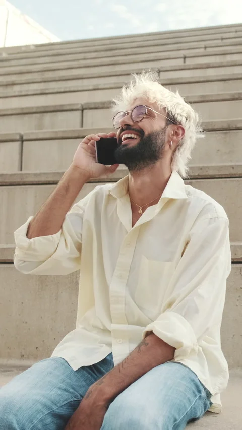 Vertical video, Happy Man Talking on Phone in City Stock Footage 313552730