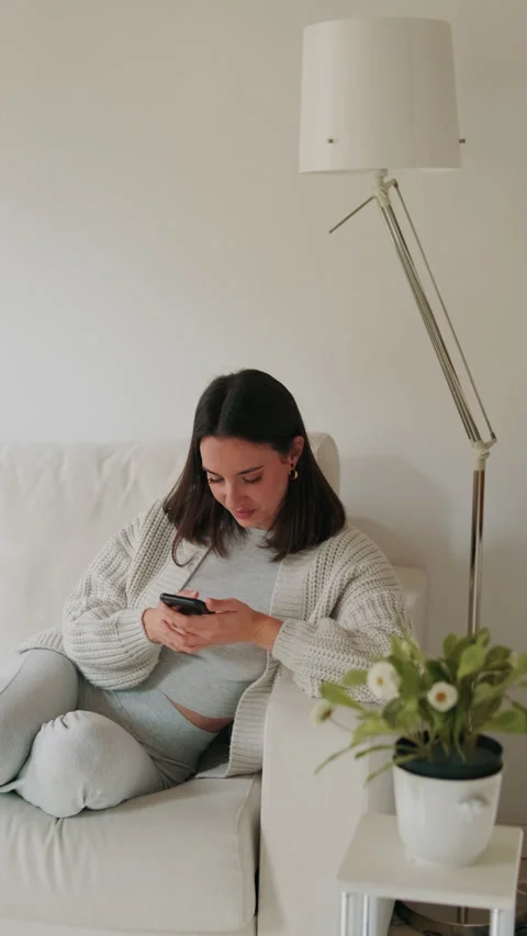 Vertical video, Happy Woman Using Phone at Home Stock Footage 314265920