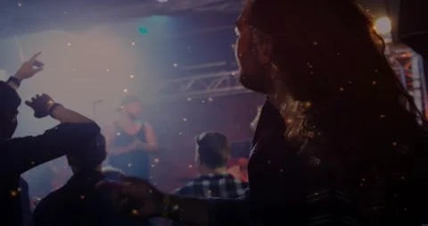 Vertical video: Headbanging man with long hair moving to pulsing music at club, Stock Footage 330427900