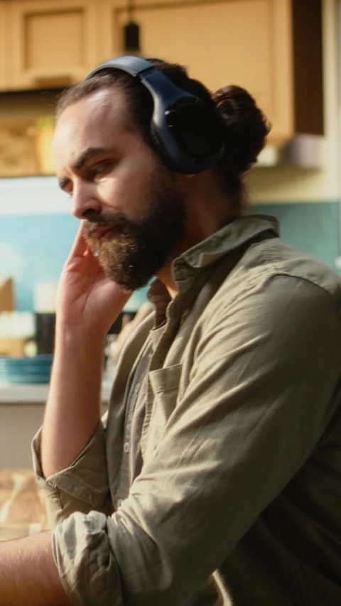 Vertical Video Headset laptop, game developer, building video game, listening to Stock Footage 330440003