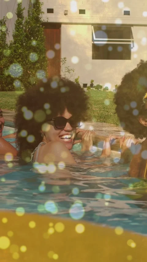 Vertical video: Hearing friends talking woman in pool shades laughing holding Stock Footage 340133451