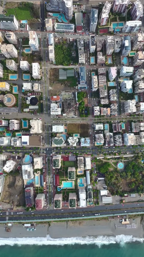 Vertical Video: Heavy lifting in action as cranes and workers progress building Stock-Footage 297634823