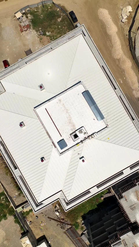 Vertical Video: High-Angle View of a Large Construction Site with Cranes and Stock Footage 297717963