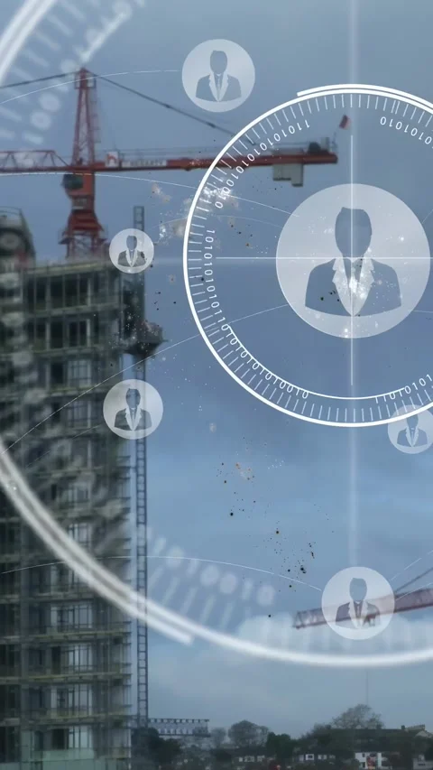 Vertical video: Highrise on left, crane lifting load, HUD activating on camera Stock Footage 334541228
