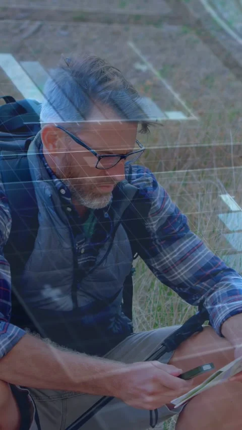 Vertical video: Hiker tapping phone and checking map on trail, adjusting route Stock Footage 333259628