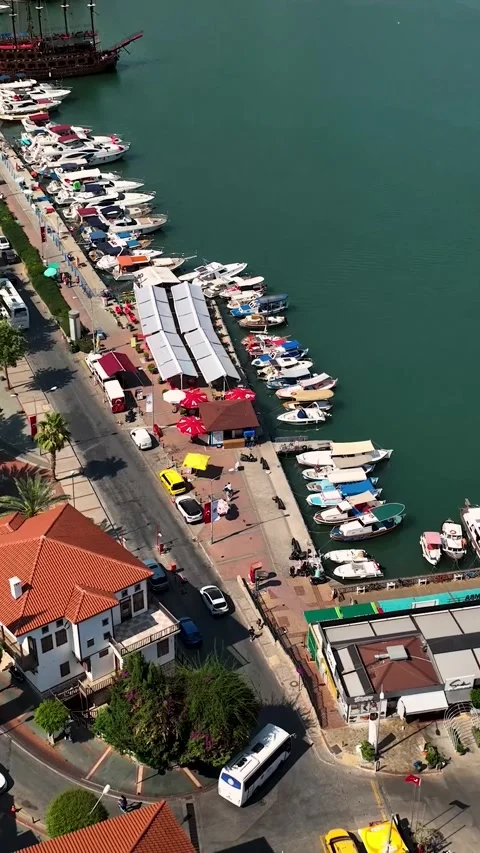 Vertical Video: Historic Red Tower in Alanya Overlooking the City with a Clear Stock Footage 297721100