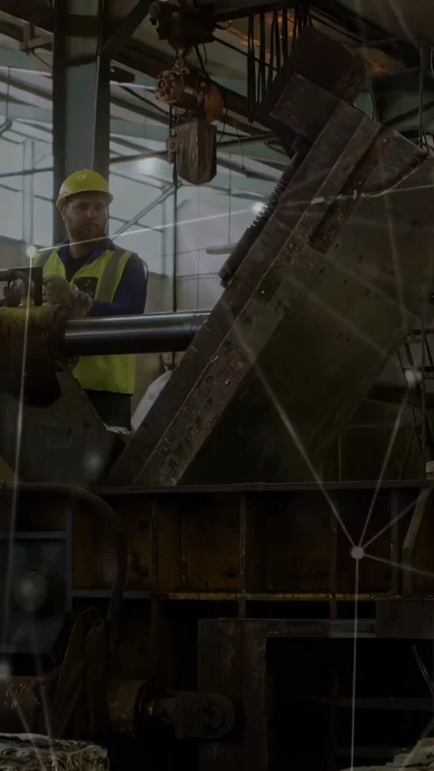 Vertical video: Hoist pulling plate factory worker guiding lever tilting to Stock Footage 334317564