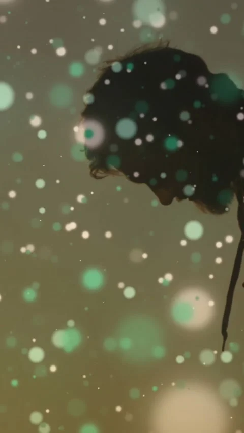 Vertical video: Hooded man tilting head, drifting bokeh passing across face, Stock Footage 329613138