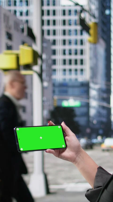 Vertical Video Horizontal mockup screen on mobile phone held by a gen z young Stock Footage 325747946