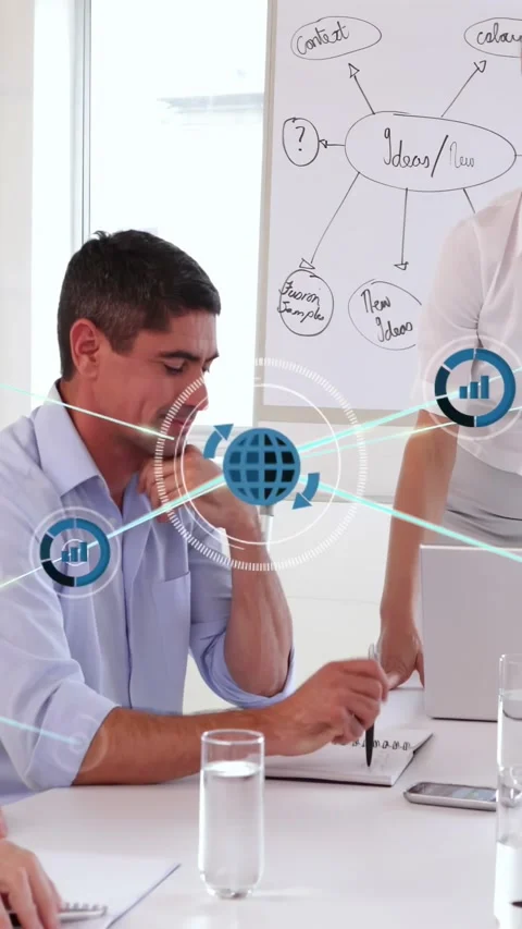 Vertical video: Host pointing at board, urging man noting ideas in business with Stock Footage 334187159
