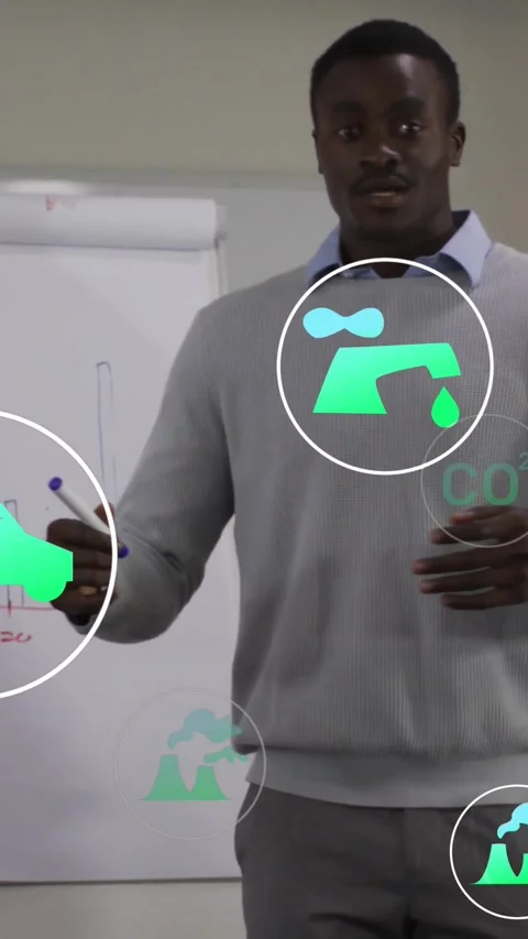 Vertical video: Host pointing chart, making green energy icons floating, tracing Stock Footage 331721446