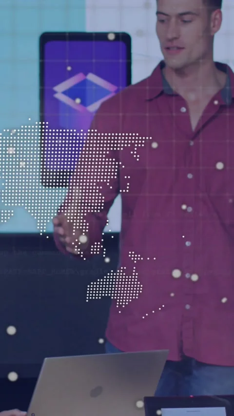Vertical video: Host pointing to laptop and initiating tech demo code and map Stock Footage 331128617