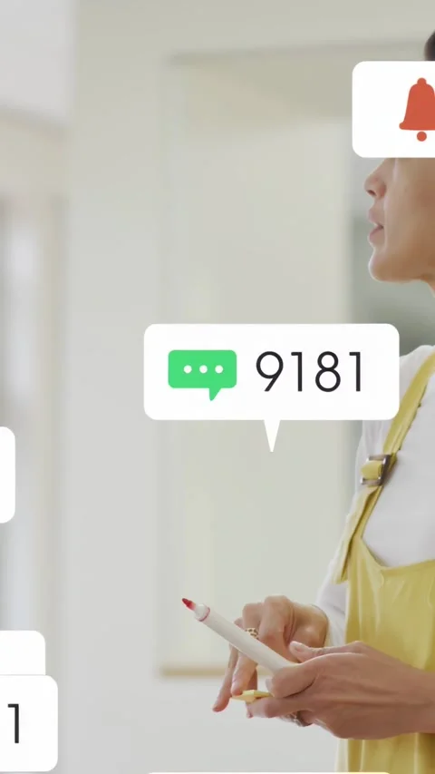 Vertical video: Host reaching toward board causing scrolling icons stacking over Stock Footage 333465274