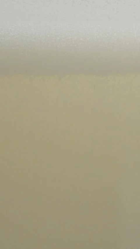 Vertical video How to easily dissolve milk powder in water for a smooth mixture Stock Footage 329618638