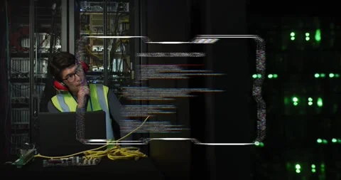 Vertical video: HUD appearing, tech in vest monitoring servers on laptop at DC, Stock Footage 334183038