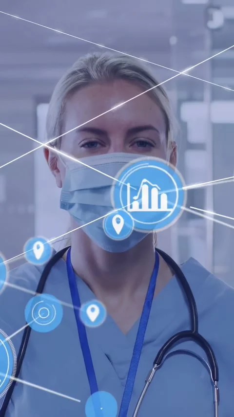 Vertical video: HUD expanding into blue icons over face as doctor donning mask Stock Footage 334541344
