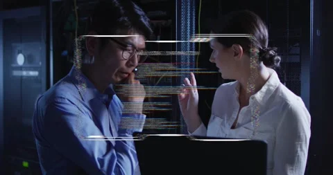 Vertical video: HUD glitching, IT pros in button-up shirts fixing laptop and Stock Footage 334112538