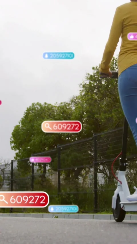 Vertical video: HUD labels appearing as woman riding scooter on path labels Stock Footage 330332867