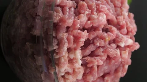 Vertical video. human hands put glass bowl with minced veal, chicken and pork. Video stock 220104598