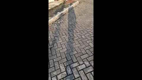 Vertical Video of Human Shadow Carrying Baby in Front Stock-Footage 336437398