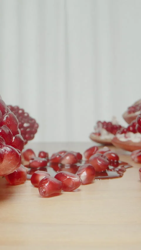 Vertical video. I Place the Bottle of Pomegranate Sauce on the Table Amidst Pome Stock Footage 254624339