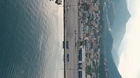Vertical video. Igoumenitsa, Greece. Large ferry moored for unloading at the Stock Footage 264013633