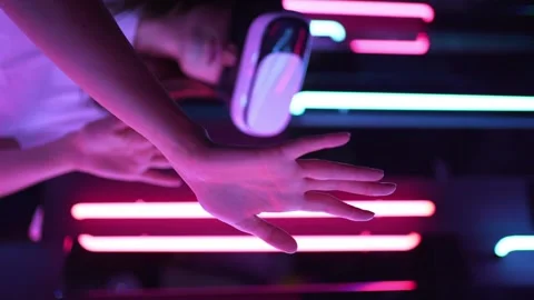 Vertical video. Immersive experience in cyberpunk and retrofuturism. Interacting Stock Footage 148079573
