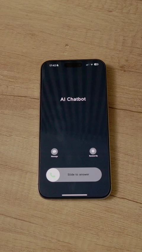 Vertical video Incoming call from AI Chatbot shown on smartphone screen placed Stock Footage 346715937
