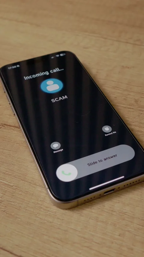 Vertical video Incoming call alert from Scam showing on smartphone screen on Stock Footage 346716244