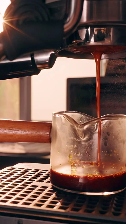 Vertical video. Incorrect Espresso Extraction with Uneven Coffee Stream from Por Stock Footage 328305208