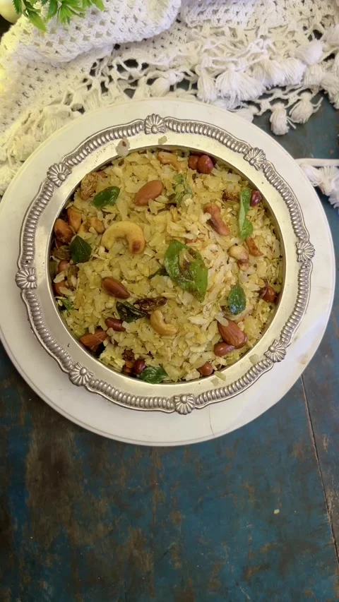 Vertical video of  Indian Snack chivda namkeen in a silver bowl. Stock Footage 287177176