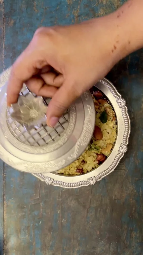 Vertical video of  Indian Snack chivda namkeen in a silver bowl. Stock Footage 287177221