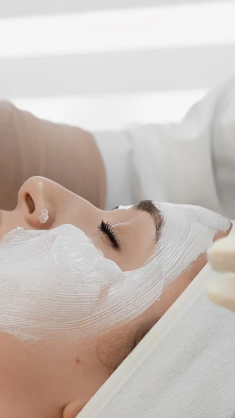 Vertical video indulge in a luxurious spa session with a professional facial Stock Footage 277908021
