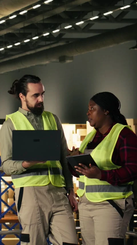 Vertical Video Industrial platform, employees in warehouse, monitoring cargo Stock Footage 330375659